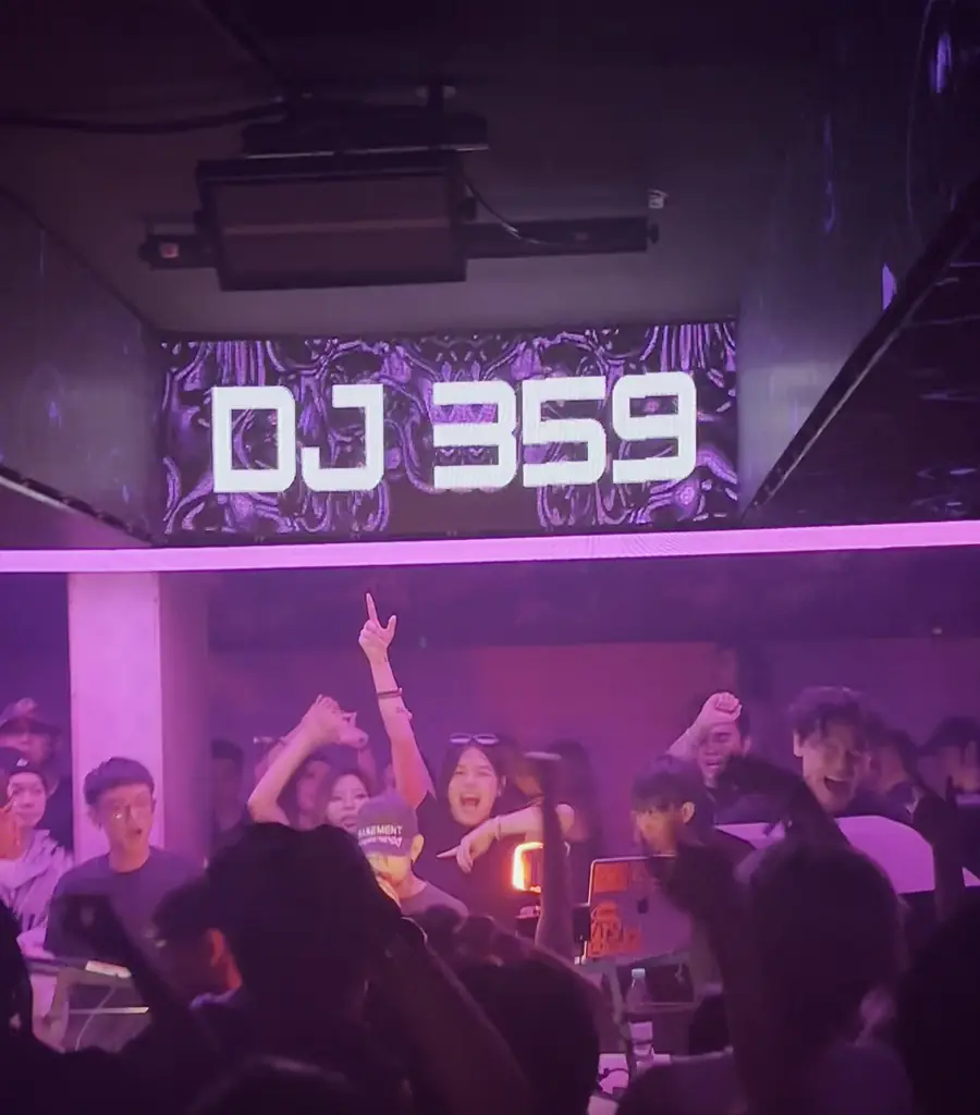A packed Basement KL dance floor in front of the DJ 359 screen